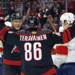
              Carolina Hurricanes' Teuvo Teravainen (86) celebrates after his goal with teammate Paul Stastny (26) as Florida Panthers' Anton Lundell (15) stands nearby during the second period of an NHL hockey game in Raleigh, N.C., Friday, Dec. 30, 2022. (AP Photo/Karl B DeBlaker)
            