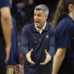 
              Virginia head coach Tony Bennett gestures during the first half of an NCAA college basketball game against Florida State in Charlottesville, Va., Saturday, Dec. 3, 2022. (AP Photo/Mike Kropf)
            