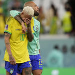 
              Brazil's Neymar reacts after the penalty shootout besides Brazil's goalkeeper Ederson at the World Cup quarterfinal soccer match between Croatia and Brazil, at the Education City Stadium in Al Rayyan, Qatar, Friday, Dec. 9, 2022. (AP Photo/Martin Meissner)
            