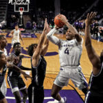 
              Kansas State guard Tykei Greene (4) shoots during the second half of an NCAA college basketball game against Abilene Christian Tuesday, Dec. 6, 2022, in Manhattan, Kan. Kansas State won 81-64. (AP Photo/Charlie Riedel)
            