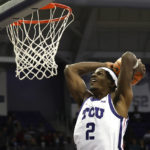 
              TCU forward Emanuel Miller (2) slam-dunks against Mississippi Valley State during the first half of an NCAA college basketball game, Sunday, Dec. 18, 2022, in Fort Worth, Texas. (AP Photo/Ron Jenkins)
            