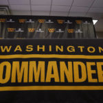 
              FILE - The Washington Commanders football team's name and logo is seen at the NFL football team's facility in Ashburn, Va., Nov. 10, 2022. According to a report published Thursday, Dec. 8, by the U.S. House Committee on Oversight and Reform, the Washington Commanders created a “toxic work culture” for more than two decades, “ignoring and downplaying sexual misconduct” by men at the top levels of the organization. (AP Photo/Manuel Balce Ceneta, File)
            