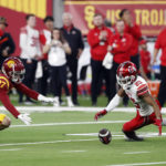 
              Utah wide receiver Jaylen Dixon (25) fumbles the ball during the first half of the Pac-12 Conference championship NCAA college football game against Southern California, Friday, Dec. 2, 2022, in Las Vegas. Southern California defensive back Bryson Shaw (27) recovered the fumble. (AP Photo/Steve Marcus)
            