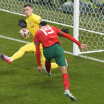 
              Croatia's goalkeeper Dominik Livakovic makes a save a shot from Morocco's Youssef En-Nesyri during the World Cup third-place playoff soccer match between Croatia and Morocco at Khalifa International Stadium in Doha, Qatar, Saturday, Dec. 17, 2022. (AP Photo/Martin Meissner)
            