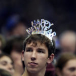 
              A Kansas fan wears a hat to celebrate New Year's Eve during the second half of an NCAA college basketball game against Oklahoma State Saturday, Dec. 31, 2022, in Lawrence, Kan. Kansas won 69-67. (AP Photo/Charlie Riedel)
            