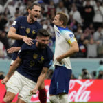 
              FILE - France's Adrien Rabiot , top, and France's Olivier Giroud celebrate after England's Harry Kane missed a penalty kick during the World Cup quarterfinal soccer match between England and France, at the Al Bayt Stadium in Al Khor, Qatar, Saturday, Dec. 10, 2022. (AP Photo/Frank Augstein, File)
            