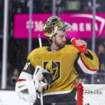 
              Vegas Golden Knights goaltender Logan Thompson (36) cools off during a timeout in the first period of the team's NHL hockey game against the St. Louis Blues on Friday, Dec. 23, 2022, in Las Vegas. (AP Photo/L.E. Baskow)
            