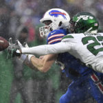 
              Buffalo Bills tight end Dawson Knox, left, is unable to make a catch as New York Jets safety Tony Adams (22) defends during the second half of an NFL football game, Sunday, Dec. 11, 2022, in Orchard Park, N.Y. (AP Photo/Adrian Kraus)
            