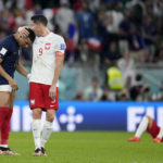 
              France's Kylian Mbappe, left, and Poland's Robert Lewandowski, right, speak after the World Cup round of 16 soccer match between France and Poland, at the Al Thumama Stadium in Doha, Qatar, Sunday, Dec. 4, 2022. (AP Photo/Natacha Pisarenko)
            