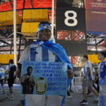 
              FILE - An Argentina soccer fan from Singapore waits outside before the World Cup group C soccer match between Poland and Argentina at the Stadium 974 in Doha, Qatar, Wednesday, Nov. 30, 2022. (AP Photo/Natacha Pisarenko, File)
            