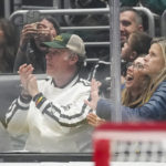 
              Actor Will Ferrell, left, applauds during the second period of an NHL hockey game between the Anaheim Ducks and the Los Angeles Kings Tuesday, Dec. 20, 2022, in Los Angeles. (AP Photo/Ashley Landis)
            