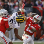 
              Ohio State defensive back Lathan Ransom, right, interferes with Michigan receiver Cornelius Johnson during the second half of an NCAA college football game on Saturday, Nov. 26, 2022, in Columbus, Ohio. (AP Photo/Jay LaPrete)
            