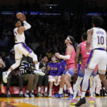 
              Los Angeles Lakers' Russell Westbrook (0) looks to pass after retrieving the ball during first half of an NBA basketball game against the Washington Wizards, Sunday, Dec. 18, 2022, in Los Angeles. (AP Photo/Jae C. Hong)
            