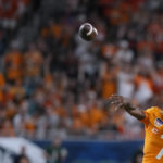
              Tennessee quarterback Joe Milton III throws a pass during the first half of the team's Orange Bowl NCAA college football game against Clemson, Friday, Dec. 30, 2022, in Miami Gardens, Fla. (AP Photo/Rebecca Blackwell)
            