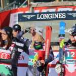 
              From left, second placed Italy's Elena Curtoni, the winner United States' Mikaela Shiffrin and third placed France's Romane Miradoli in the the finish area after an alpine ski, women's World Cup Super-G race, in St. Moritz, Switzerland, Sunday, Dec. 18, 2022. (AP Photo/Marco Trovati)
            