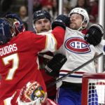 
              Florida Panthers defenseman Radko Gudas (7) grabs Montreal Canadiens right wing Josh Anderson, right, during the first period of an NHL hockey game, Thursday, Dec. 29, 2022, in Sunrise, Fla. (AP Photo/Lynne Sladky)
            