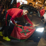
              Morocco fans celebrate in Barcelona, Spain, after defeating Portugal in the World Cup quarterfinal soccer match played in Qatar, Saturday, Dec. 10, 2022. (AP Photo/Joan Mateu Parra)
            
