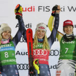 
              United States' Mikaela Shiffrin, center, winner of an alpine ski, World Cup women's slalom, celebrates on the podium with second placed United States' Paula Moltzan, left, and third placed Germany's Lena Duerr, in Semmering, Austria, Thursday, Dec. 29, 2022. (AP Photo/Giovanni Auletta)
            