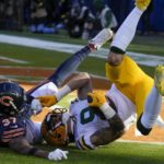 
              Green Bay Packers' Christian Watson catches a touchdown pass with Chicago Bears' Elijah Hicks defending during the first half of an NFL football game Sunday, Dec. 4, 2022, in Chicago. (AP Photo/Nam Y. Huh)
            