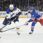 
              St. Louis Blues defenseman Robert Bortuzzo (41) and New York Rangers left wing Artemi Panarin (10) battle for the puck in the first period of an NHL hockey game, Monday, Dec. 5, 2022, in New York. (AP Photo/John Minchillo)
            