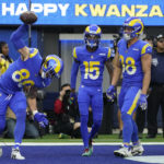 
              Los Angeles Rams tight end Tyler Higbee celebrates after scoring during the first half of an NFL football game between the Los Angeles Rams and the Denver Broncos on Sunday, Dec. 25, 2022, in Inglewood, Calif. (AP Photo/Marcio J. Sanchez)
            