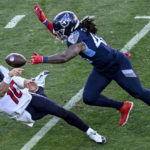 
              Houston Texans quarterback Davis Mills (10) attempts a pass against Tennessee Titans linebacker Bud Dupree (48) during the second half of an NFL football game, Saturday, Dec. 24, 2022, in Nashville, Tenn. (AP Photo/John Amis)
            