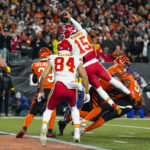 
              Kansas City Chiefs quarterback Patrick Mahomes (15) goes over the top to score a touchdown against the Cincinnati Bengals in the second half of an NFL football game in Cincinnati, Fla., Sunday, Dec. 4, 2022. (AP Photo/Jeff Dean)
            