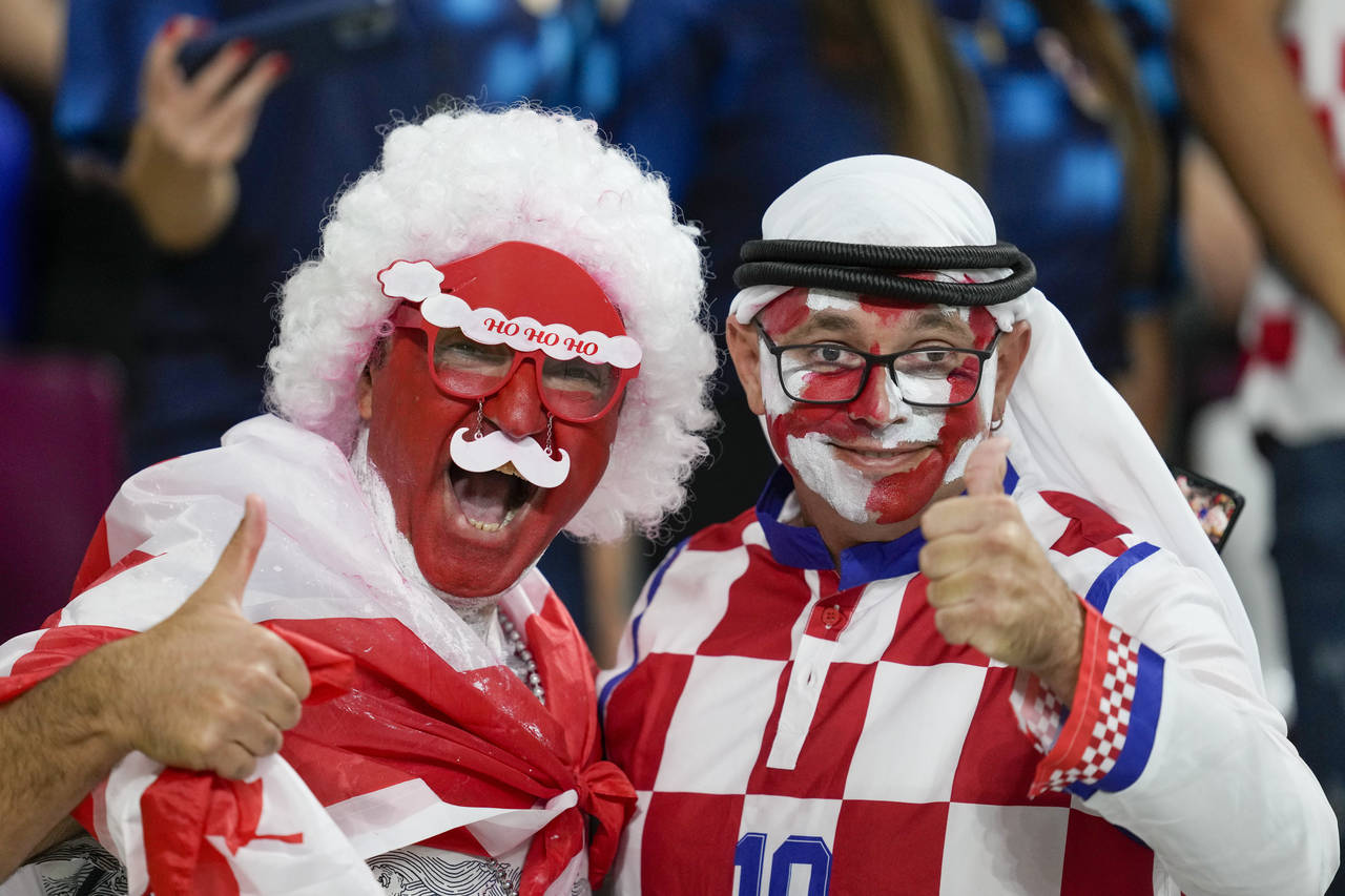 FILE - Croatia and Canada fans cheer ahead of the World Cup group F soccer match between Croatia an...