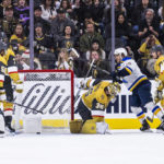 
              Vegas Golden Knights goaltender Logan Thompson (36) is scored on with St. Louis Blues center Robert Thomas (18) close in during the second period of an NHL hockey game Friday, Dec. 23, 2022, in Las Vegas. (AP Photo/L.E. Baskow)
            