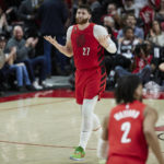 
              Portland Trail Blazers center Jusuf Nurkic (27) gestures after making a 3-point basket against the Charlotte Hornets during the second half of an NBA basketball game in Portland, Ore., Monday, Dec. 26, 2022. (AP Photo/Craig Mitchelldyer)
            