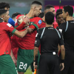 
              Moroccan players confront referee Abdulrahman Al Jassim, right, of Qatar at the end of the World Cup third-place playoff soccer match between Croatia and Morocco at Khalifa International Stadium in Doha, Qatar, Saturday, Dec. 17, 2022. (AP Photo/Francisco Seco)
            