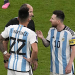 
              Argentina's Lionel Messi, right, and Argentina's Lautaro Martinez argue with referee Antonio Mateu during the World Cup quarterfinal soccer match between the Netherlands and Argentina, at the Lusail Stadium in Lusail, Qatar, Friday, Dec. 9, 2022. (AP Photo/Thanassis Stavrakis)
            