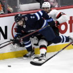 
              Ottawa Senators' Mark Kastelic (47) works against Winnipeg Jets' Dylan Demelo (2) during the second period of an NHL hockey game Tuesday, Dec. 20, 2022, in Winnipeg, Manitoba. (Fred Greenslade/The Canadian Press via AP)
            