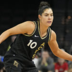 
              FILE - Las Vegas Aces' Kelsey Plum drives against the Dallas Wings during the second half of a WNBA basketball game June 5, 2022, in Las Vegas. Plum has been elected to serve as first vice president of the WNBA Players Association. It is her first term on the WNBPA Executive Committee. (AP Photo/John Locher, File)
            