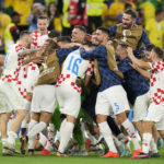 
              Croatia team celebrate after the World Cup quarterfinal soccer match between Croatia and Brazil, at the Education City Stadium in Al Rayyan, Qatar, Friday, Dec. 9, 2022. (AP Photo/Andre Penner)
            