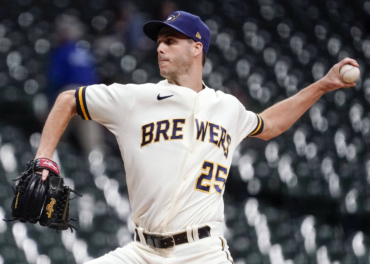 FILE - Milwaukee Brewers' Taylor Rogers throws during the eighth inning of a baseball game against ...