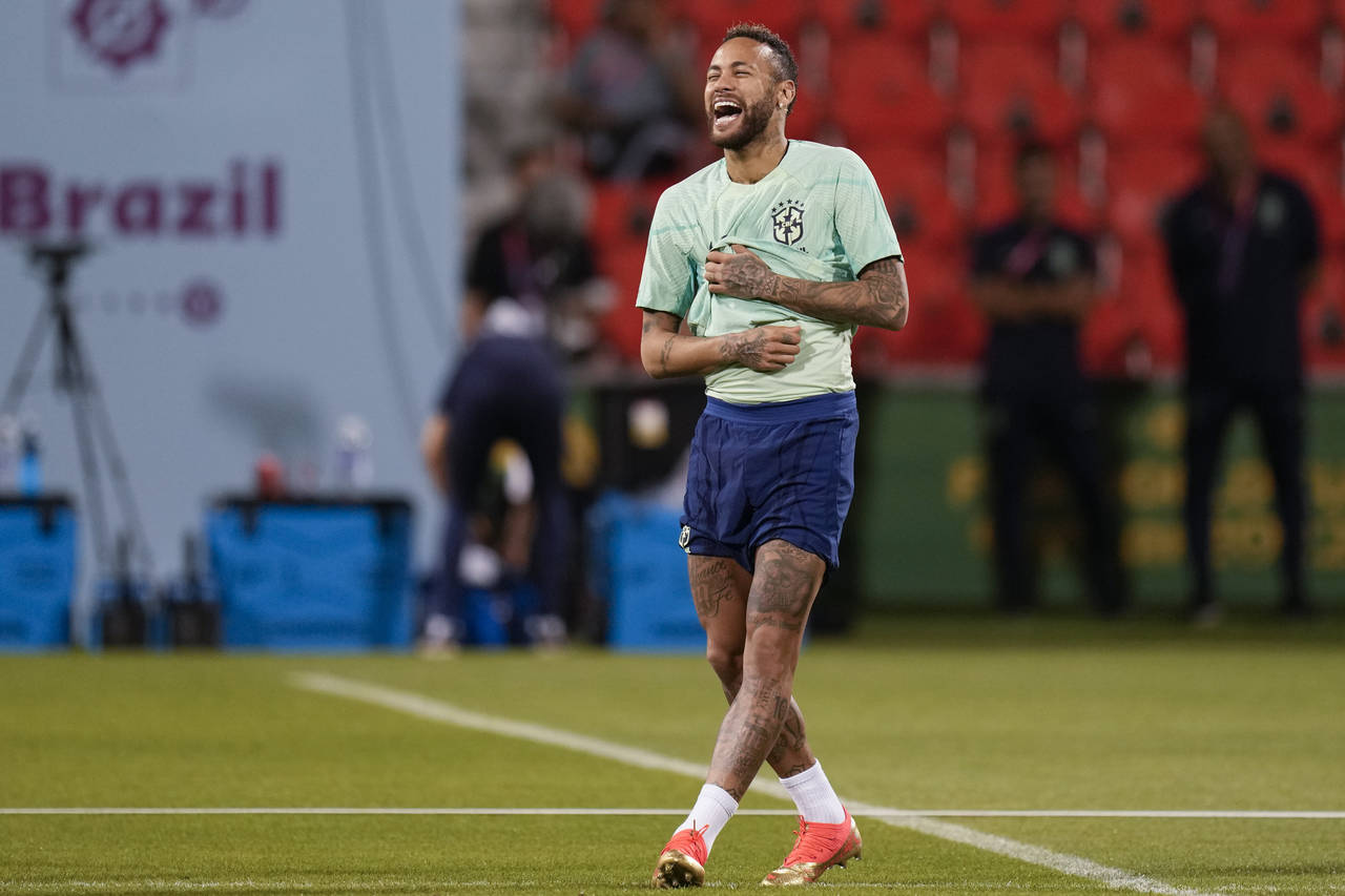 Brazil's Neymar smiles during a training session at the Grand Hamad stadium in Doha, Qatar, Sunday,...