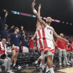 
              Arizona players celebrate after a 3-point basket against Indiana during the second half of an NCAA college basketball game Saturday, Dec. 10, 2022, in Las Vegas. (AP Photo/Chase Stevens)
            