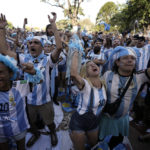 
              Argentina soccer fans celebrate their team's victory over Croatia as they watch the team's World Cup semifinal match in Qatar on a screen set up in the Palermo neighborhood of Buenos Aires, Argentina, Tuesday, Dec. 13, 2022. (AP Photo/Rodrigo Abd)
            