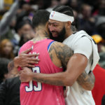 
              Washington Wizards forward Kyle Kuzma, left, and Los Angeles Lakers forward Anthony Davis hug after an NBA basketball game, Sunday, Dec. 4, 2022, in Washington. The Lakers won 130-119. (AP Photo/Jess Rapfogel)
            