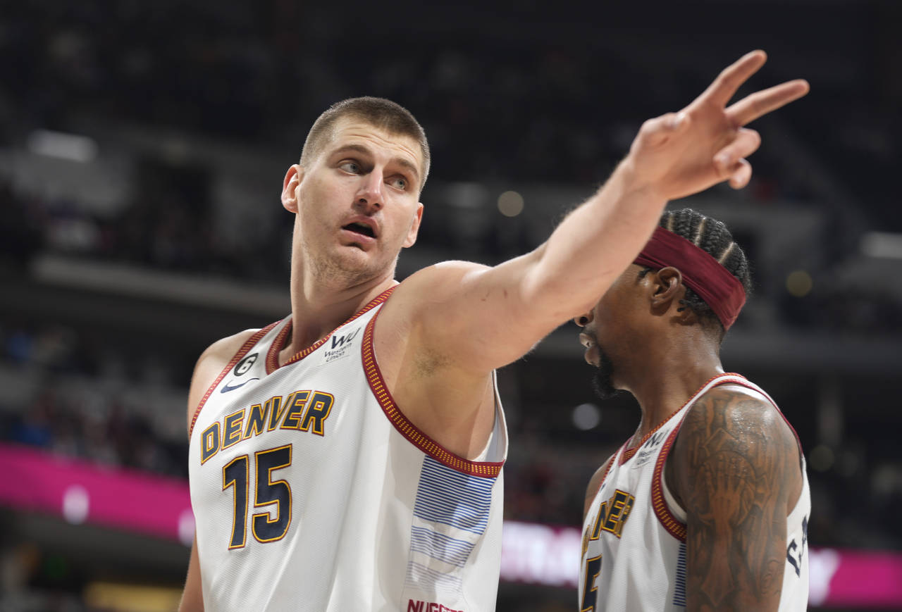 Denver Nuggets center Nikola Jokic gestures after being clled for a foul in the second half of an N...