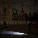 
              A woman walks with a flashlight during a power outage in Kyiv, Ukraine, Wednesday, Dec. 14, 2022. (AP Photo/Felipe Dana)
            