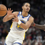 
              Golden State Warriors guard Jordan Poole (3) passes off the ball as Toronto Raptors forward Pascal Siakam (43) looks on during second-half NBA basketball game action in Toronto, Sunday, Dec. 18, 2022. (Frank Gunn/The Canadian Press via AP)
            