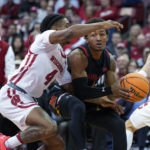 
              Maryland's Jahmir Young (1) maneuvers against Wisconsin's Kamari McGee (4) during the first half of an NCAA college basketball game Tuesday, Dec. 6, 2022, in Madison, Wis. (AP Photo/Andy Manis)
            