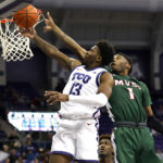 
              TCU guard Shahada Wells (13) gets to the basket as Mississippi Valley State guard Tyronn Mosley (1) defends during the first half of an NCAA college basketball game, Sunday, Dec. 18, 2022, in Fort Worth, Texas. (AP Photo/Ron Jenkins)
            