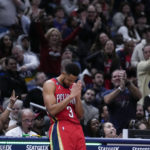 
              New Orleans Pelicans guard CJ McCollum (3) reacts to the crowd as he was acknowledged for setting a franchise record of eleven 3-pointers in a game, in the second half of an NBA basketball game against the Philadelphia 76ers in New Orleans, Friday, Dec. 30, 2022. McCollum also set his season high in scoring with 42 points, and the Pelicans won 127-116. (AP Photo/Gerald Herbert)
            
