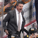 
              Pittsburgh Penguins coach Mike Sullivan gives instructions during the first period of the team's NHL hockey game against the Detroit Red Wings in Pittsburgh, Wednesday, Dec. 28, 2022. (AP Photo/Gene J. Puskar)
            