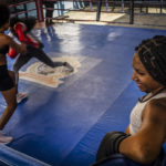 
              Ydamelys Moreno, right, watches as fellow female boxers train in Havana, Cuba, Monday, Dec. 5, 2022. Cuban officials announced on Monday that women boxers would be able to compete for the first time ever. (AP Photo/Ramon Espinosa)
            