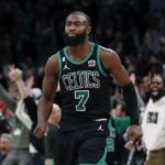 
              Boston Celtics' Jaylen Brown reacts after making the tying three-pointer during the second half of an NBA basketball game against the Miami Heat, Friday, Dec. 2, 2022, in Boston. (AP Photo/Michael Dwyer)
            