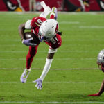 
              Arizona Cardinals wide receiver Robbie Anderson (81) is tackled after a catch against the New England Patriots during the first half of an NFL football game, Monday, Dec. 12, 2022, in Glendale, Ariz. (AP Photo/Darryl Webb)
            